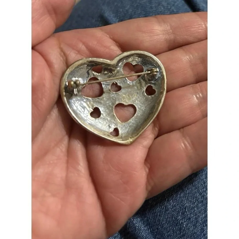 Vintage silver tone heart brooch with‎ cutout hearts